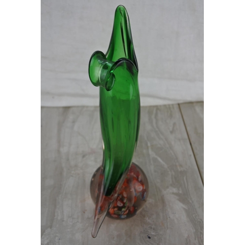 15 - An unusual and  stunning vintage glass paperweight with a mounted green glass vase.  Approx 28cm.