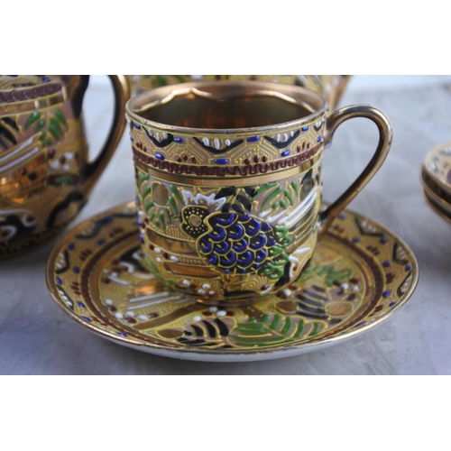 20 - A Japanese coffee set with gilt detail.