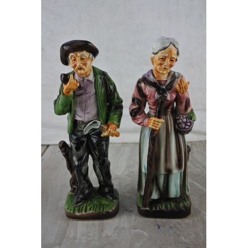 21 - A pair of vintage ceramic figures.