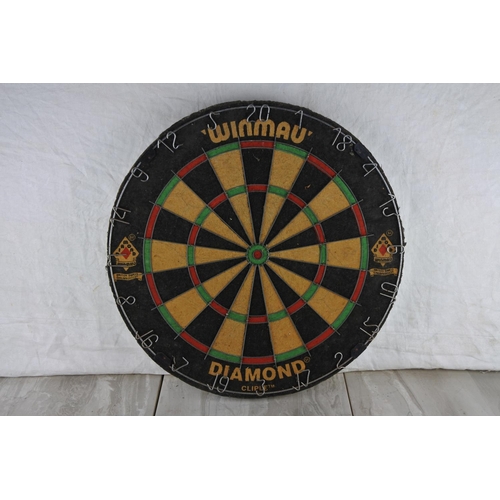 63 - A Winmau dart board.