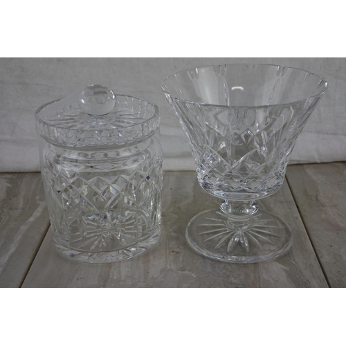 66 - A stunning Waterford Crystal biscuit barrel and a cut glass vase.