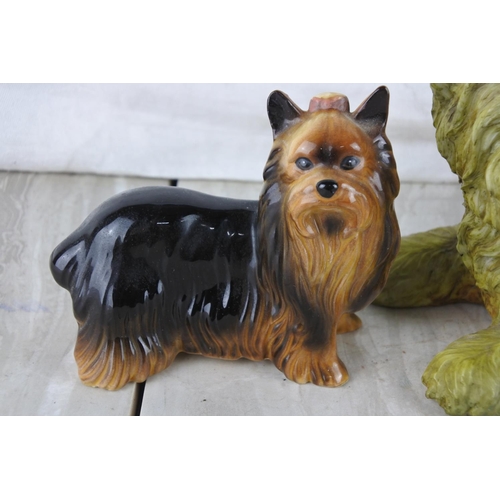 70 - A vintage Sylvac number 5027 Yorkshire Terrier sitting dog and two others.