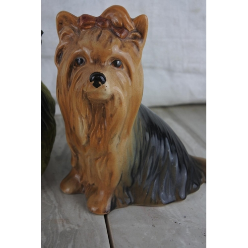 70 - A vintage Sylvac number 5027 Yorkshire Terrier sitting dog and two others.