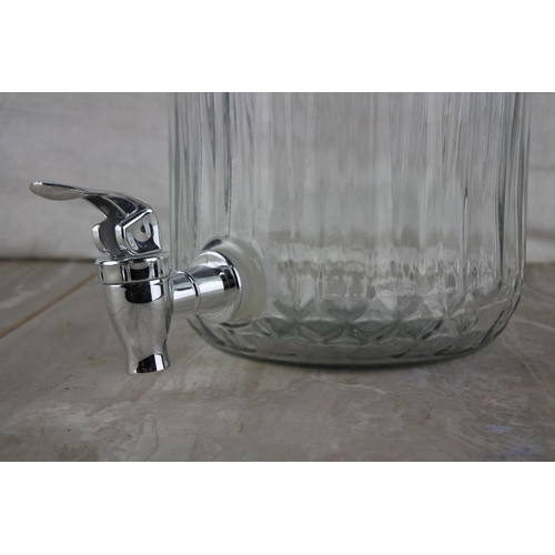 71 - A glass drinks dispenser with tap.