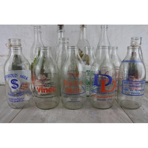 76 - A large lot of vintage glass milk bottles.