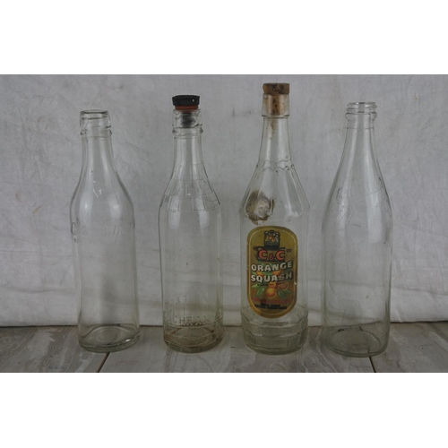 76 - A large lot of vintage glass milk bottles.