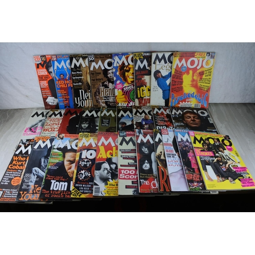 82 - A lot of Mojo magazines.