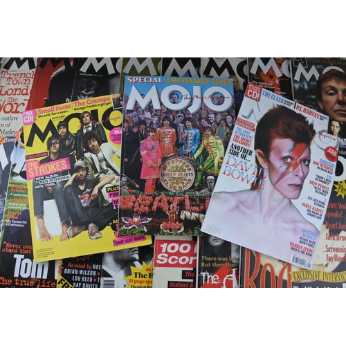 82 - A lot of Mojo magazines.