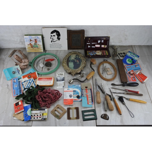 88 - A boxed lot of various collectables to include an antique picture frame stamped by the maker , a lot... 