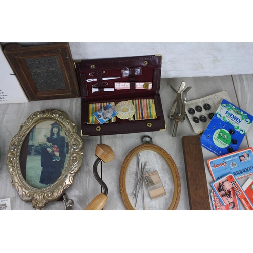 88 - A boxed lot of various collectables to include an antique picture frame stamped by the maker , a lot... 