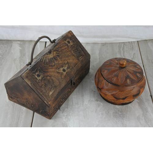 98 - A wooden carved jewellery box and a lidded pot.