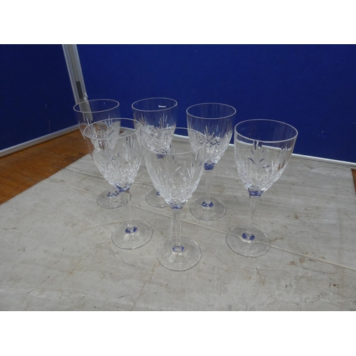 100 - A set of six crystal wine glasses.