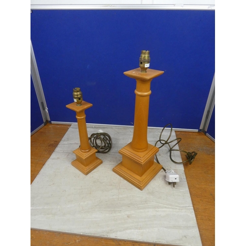 113 - Two wood based table lamp bases..  Tallest approx 47cm.