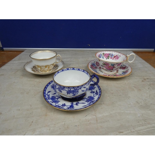 118 - A lot of three antique cabinet cups and saucers.