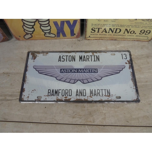 120 - Five metal advertising plaques.  Approx 20x30cm.