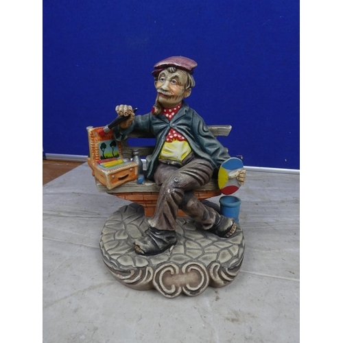 126 - A ceramic figure of an artist.  Approx 20cm.