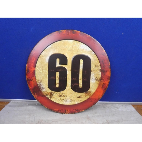 128 - A metal sign '60'.  Approx 35cm.