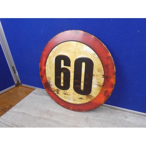 128 - A metal sign '60'.  Approx 35cm.