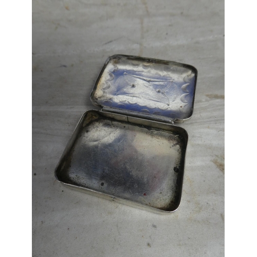 158 - An engraved white metal pill box with turquoise detail.