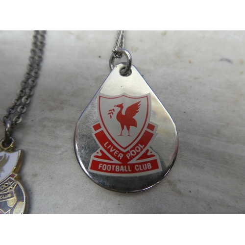 161 - Two Liverpool Football Club pendants and chains.