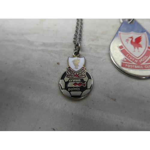 161 - Two Liverpool Football Club pendants and chains.