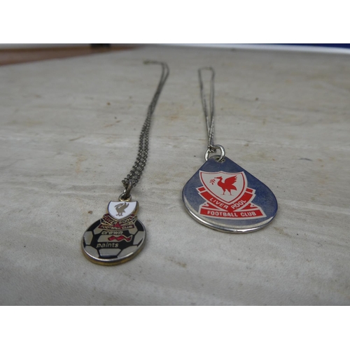 161 - Two Liverpool Football Club pendants and chains.