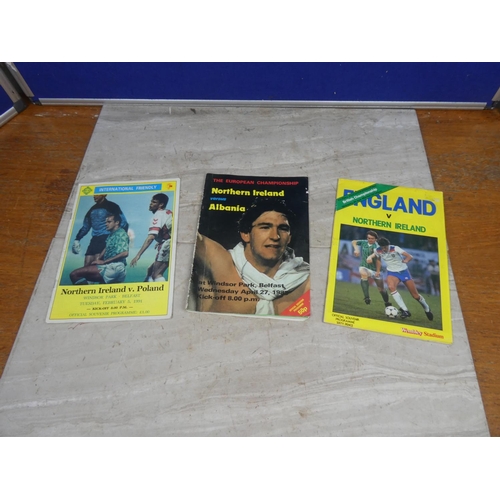 185 - Three vintage football programmes, Northern Ireland verses England, Albania and Poland.