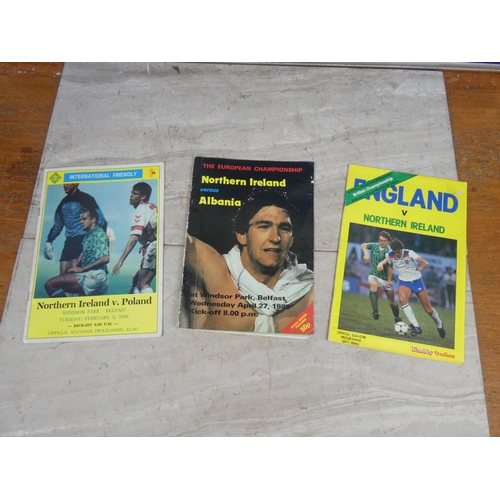 185 - Three vintage football programmes, Northern Ireland verses England, Albania and Poland.