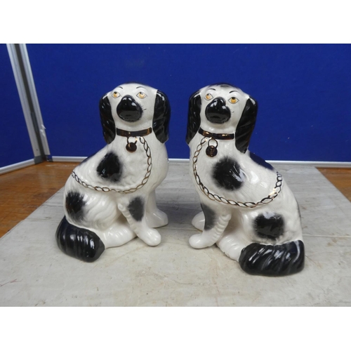 198 - A pair of vintage mantle dogs.  Approx 23cm.