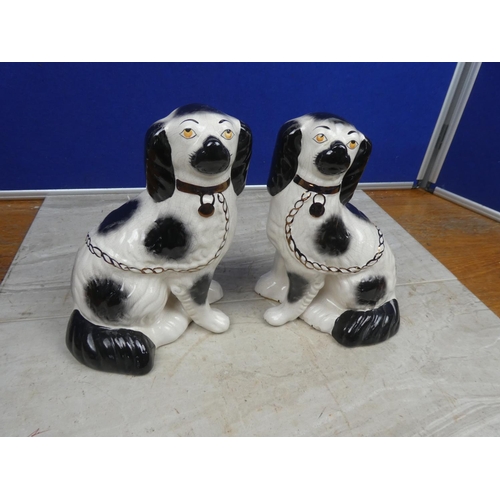 198 - A pair of vintage mantle dogs.  Approx 23cm.