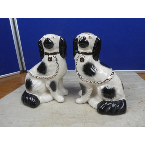 198 - A pair of vintage mantle dogs.  Approx 23cm.