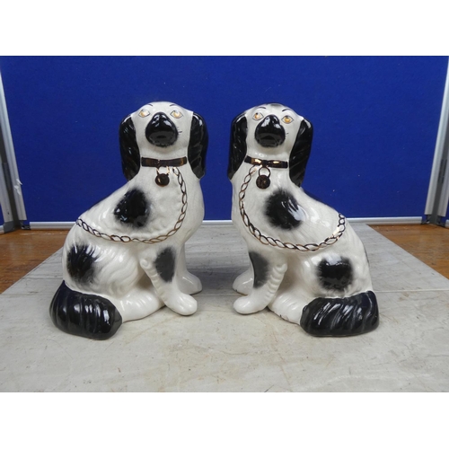 198 - A pair of vintage mantle dogs.  Approx 23cm.