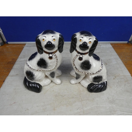 198 - A pair of vintage mantle dogs.  Approx 23cm.