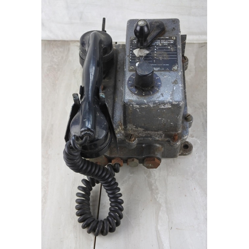 204 - A vintage military telephone.