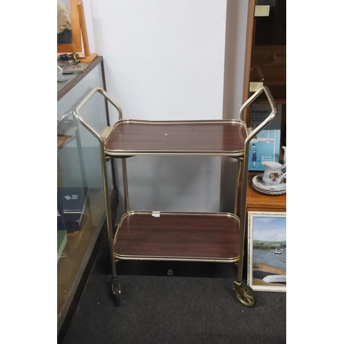 215 - A vintage two tier drinks trolley with removable tray.