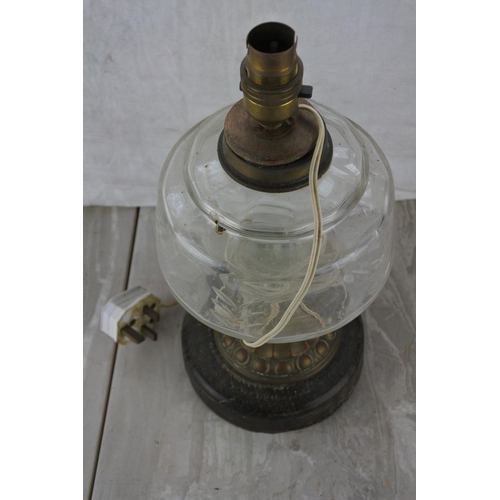 223 - An electric oil lamp table lamp base.  Approx 34cm.