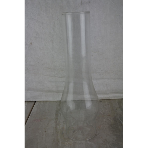 224 - An oil lamp glass chimney.  Approx 25cm.