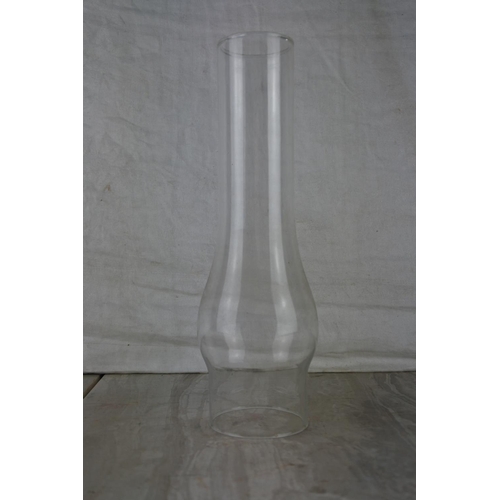 224 - An oil lamp glass chimney.  Approx 25cm.