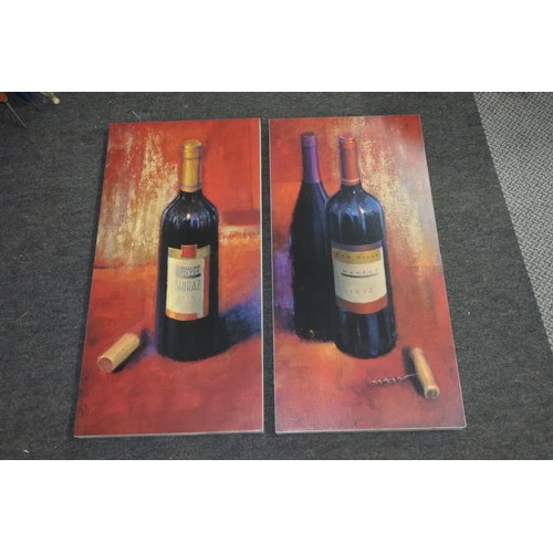 225 - A large pair of wine bottle canvases.  Approx 39x79cm.