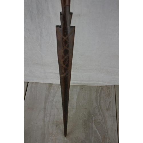 239 - A carved tribal spear.