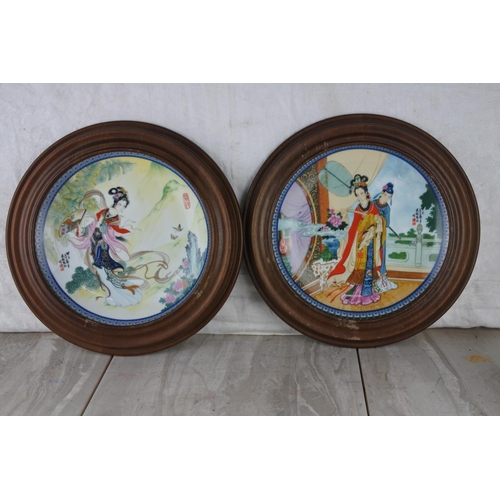 246 - Two wooden framed oriental ceramic plates.  Approx 29cm.