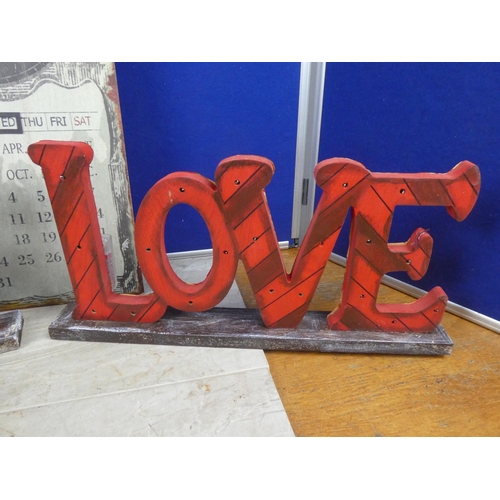 279 - Two wooden illuminated 'Love' signs.  Approx 50x23cm.