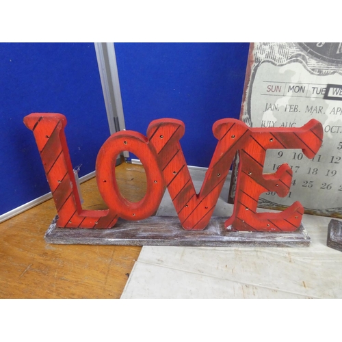 279 - Two wooden illuminated 'Love' signs.  Approx 50x23cm.