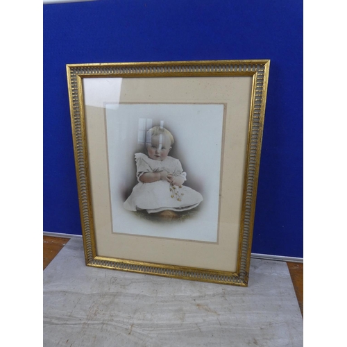 281 - A gilt framed portrait of a child.  Approx 39x46cm.