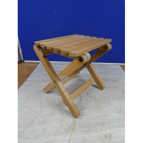 282 - A folding stool.  Approx 25x24x22cm.