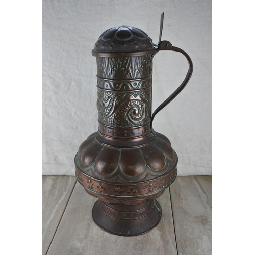 317 - A stunning highly decorative lidded copper urn.  Approx 52cm.