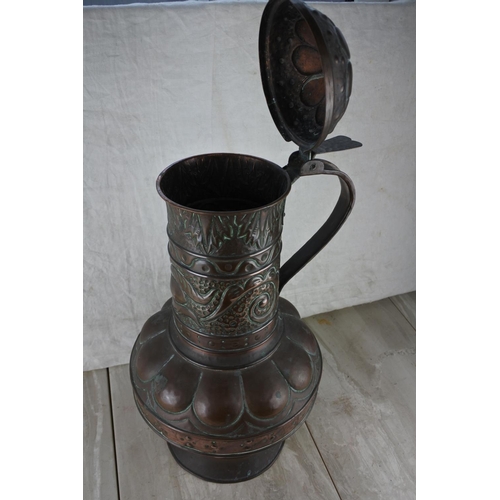 317 - A stunning highly decorative lidded copper urn.  Approx 52cm.