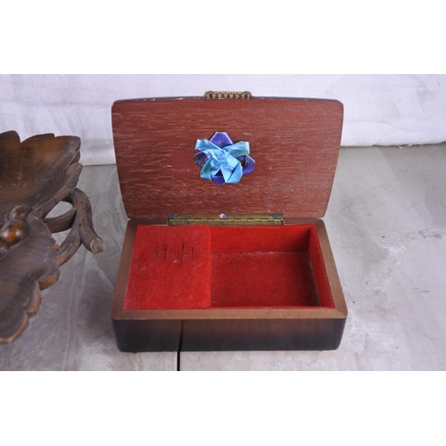 319 - A wooden musical maple leaf dish and a musical jewellery box, both made in Switzerland.