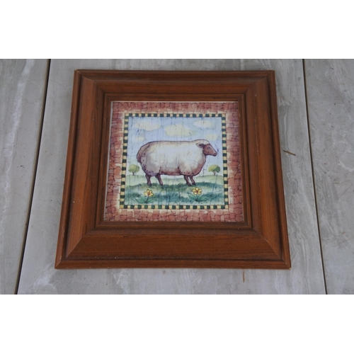 333 - A framed ceramic tile of a sheep.