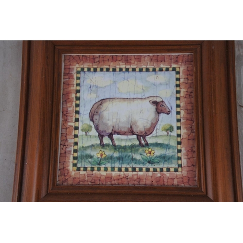 333 - A framed ceramic tile of a sheep.